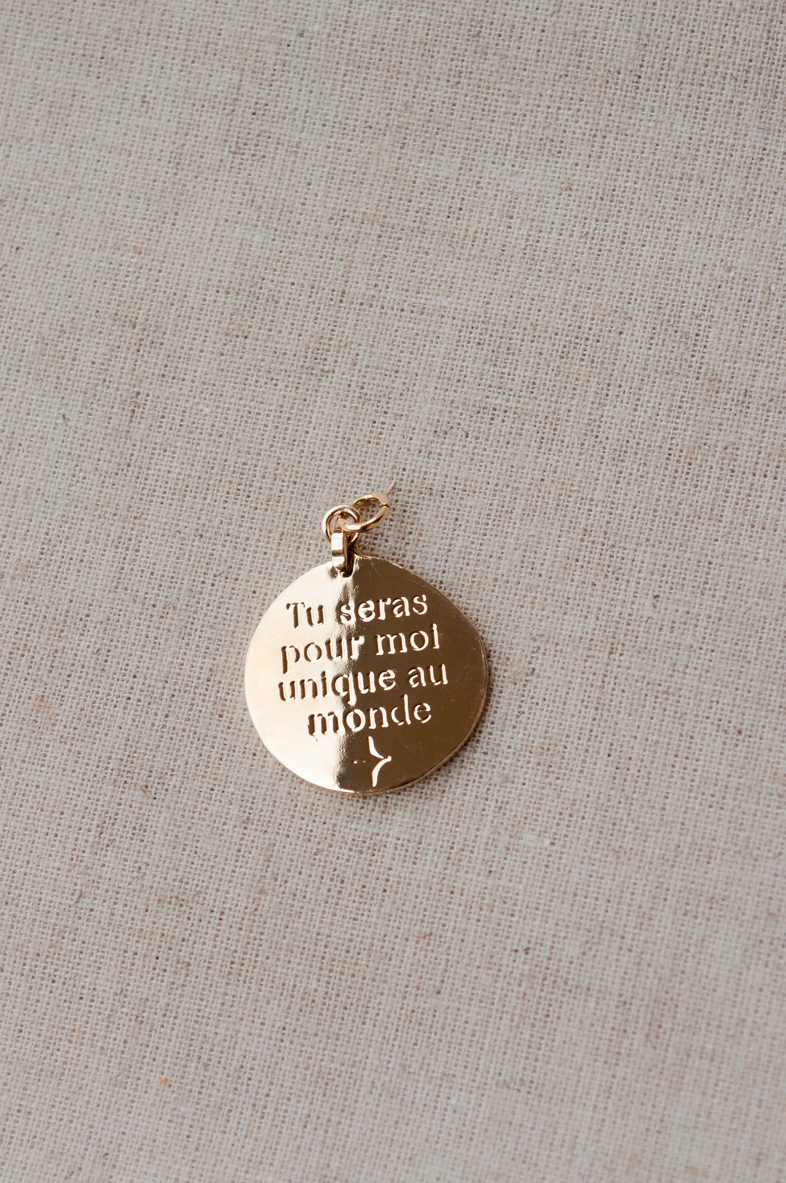 Pendentif "Unique au monde" Un de ces quatre 